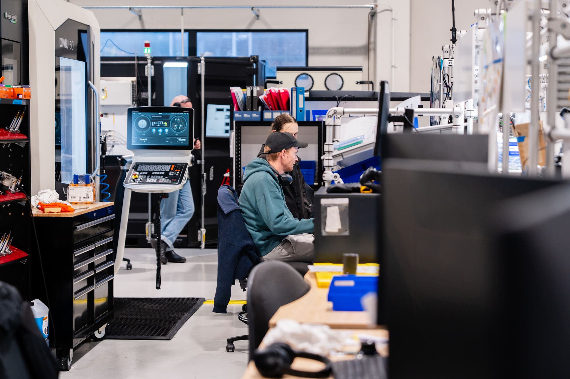 Engineers at work in a manufacturing workshop